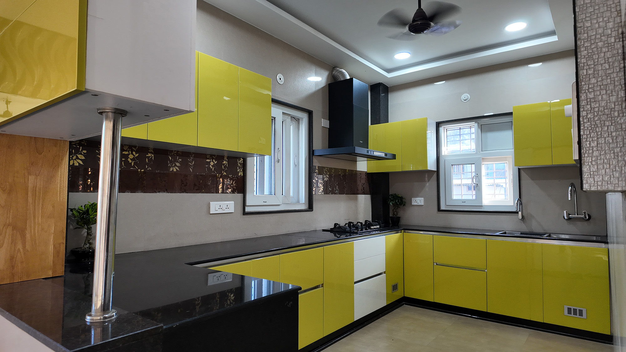 Modular Kitchen in Jhapa with a harmonious blend of yellow color and textures.